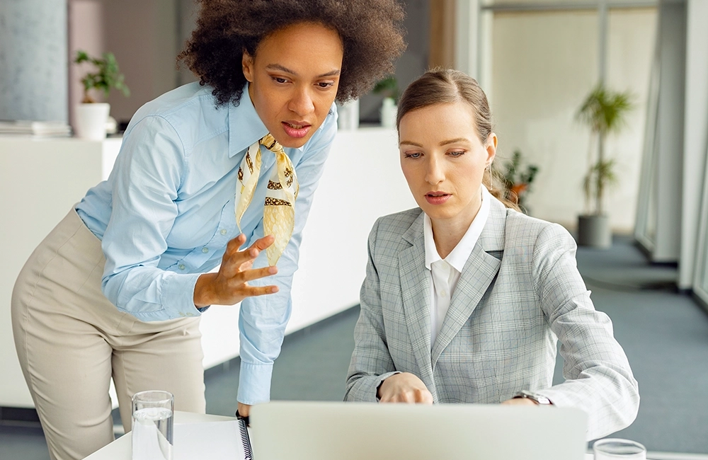 People in a meeting reviewing quarterly results