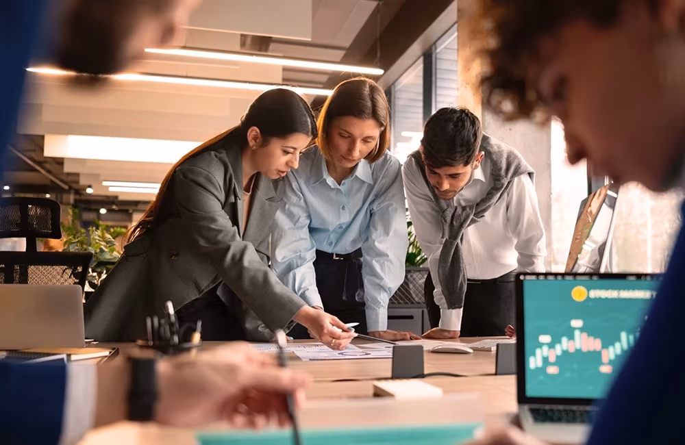 People in a meeting reviewing quarterly results