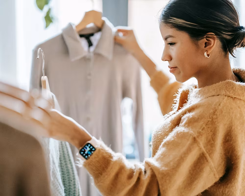 Woman picking up some clothes