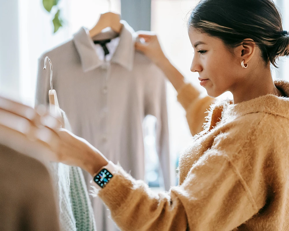 Woman picking up some clothes
