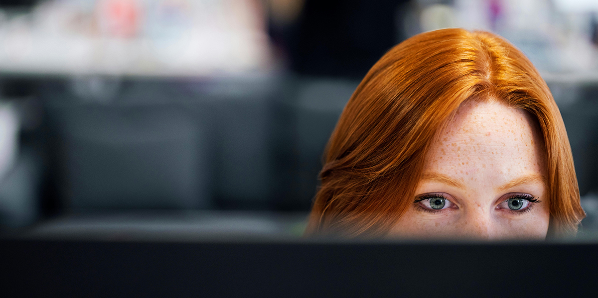 Developer working on some code on her Mac computer