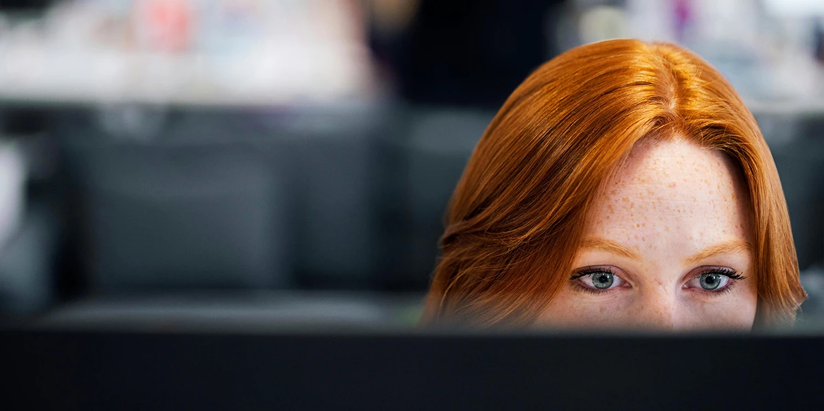 Developer working on some code on her Mac computer