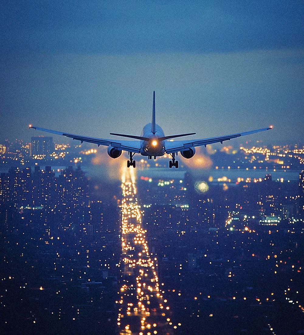 Commercial airplane taking off at sunset