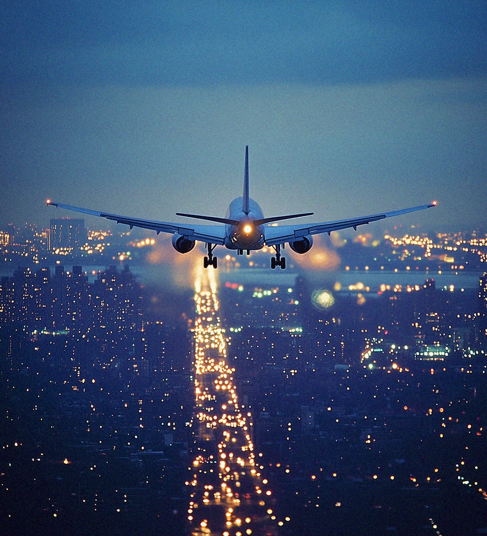 Commercial airplane taking off at sunset